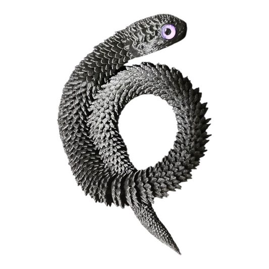 Top-down view of 3D printed black snake with curled body and realistic reptile eye – flexible articulated 3D printing fidget toy