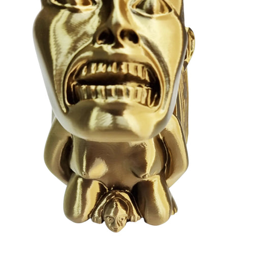 Close up of Chachapoyan Fertility Idol baby detail, 3D printed silk gold Indiana Jones movie prop replica