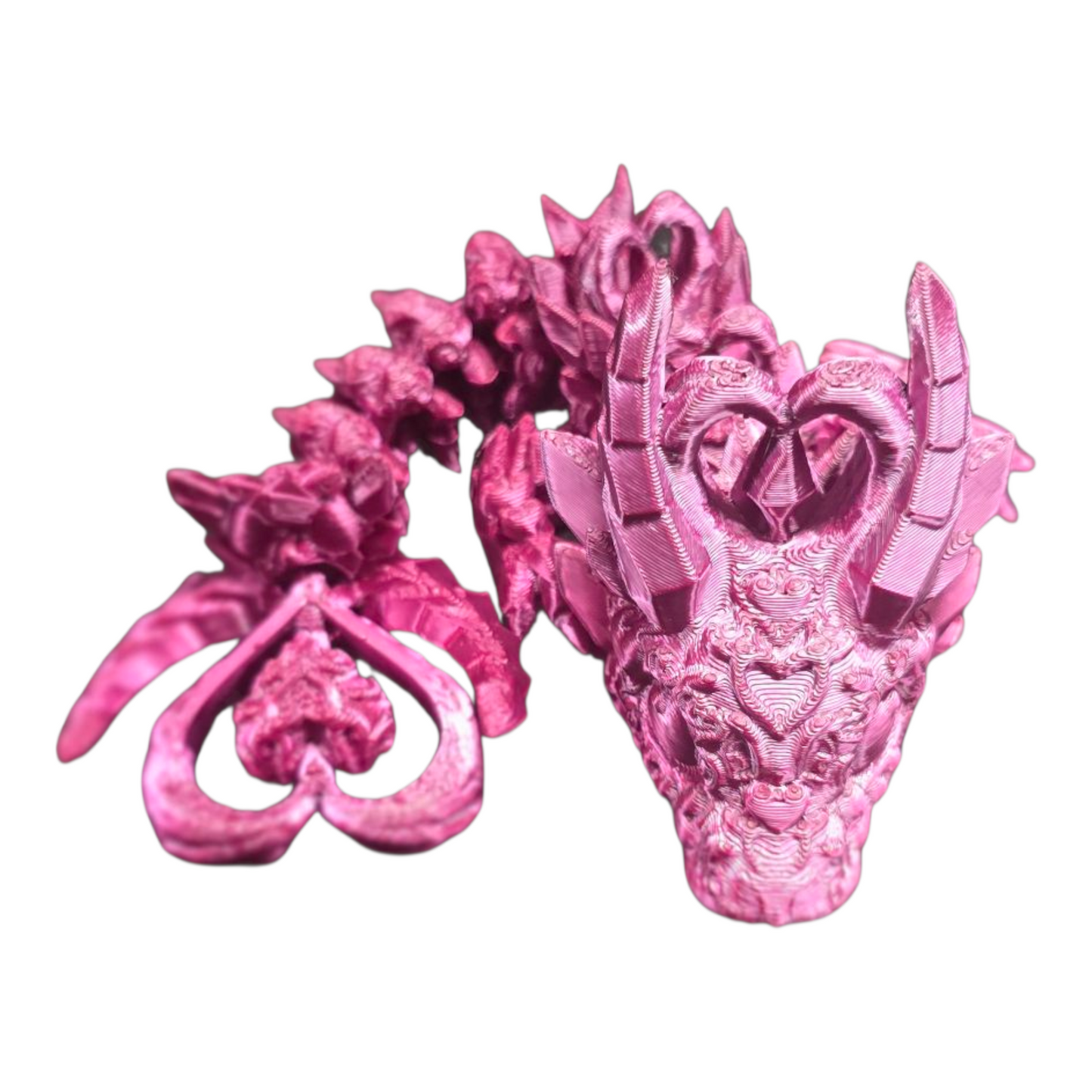 3D printed baby dark heart dragon curled tail detail – close-up view of flexible articulated fantasy creature gift