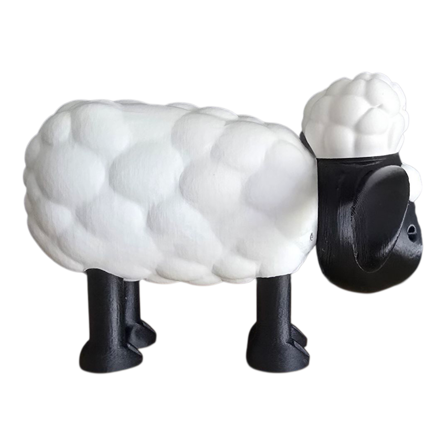 side view of 3d printed shaun the sheep inspired figurine with fluffy white body and black legs on white background