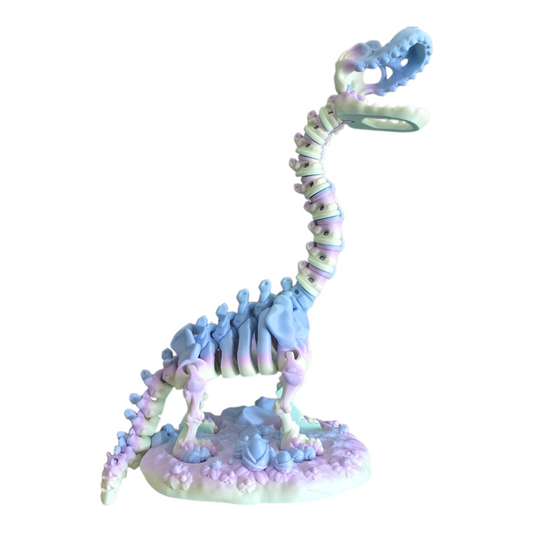 Articulated 3D printed brachiosaurus on display stand with opening mouth, rainbow pastel filament