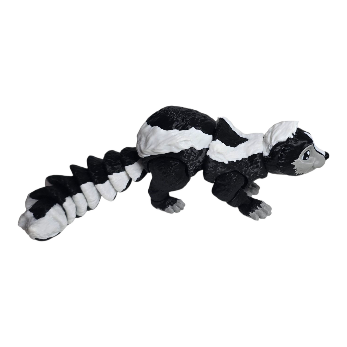 3d printed black and white skunk collectible with flexible tail segments