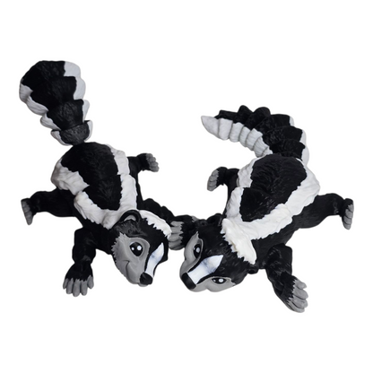 articulated 3D printed skunk figurine with locking tail, poseable head and feet on white background