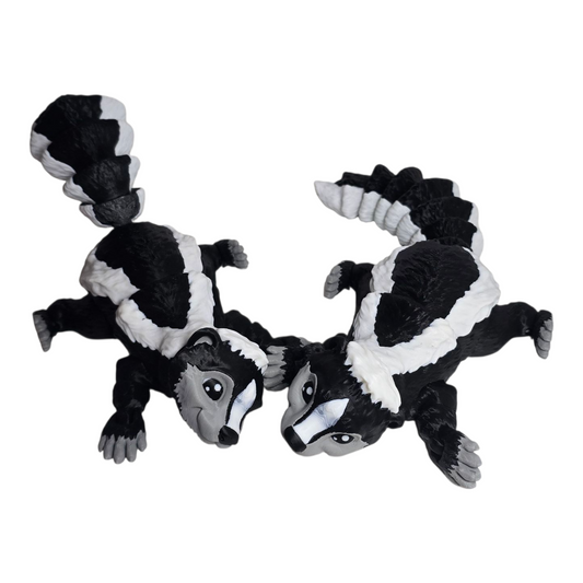 articulated 3D printed skunk figurine with locking tail, poseable head and feet on white background